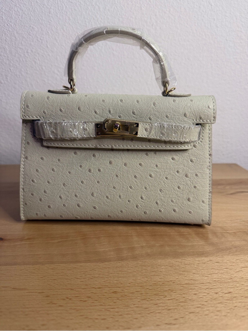 H Mini Kelly Sellier 20 embossed ostrich leather GHW craie beton cream
